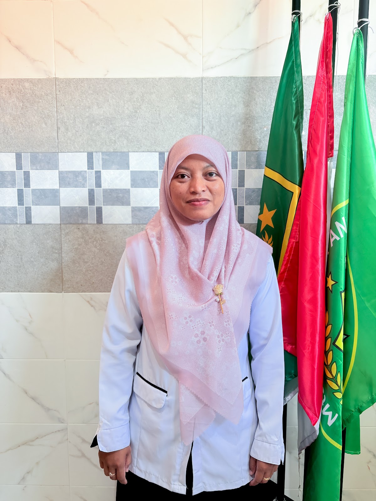 Siti Zainab, S.Pd., Gr